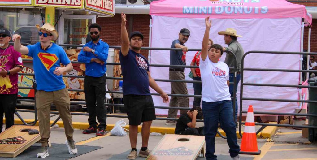 cornhole players at torc fiesta